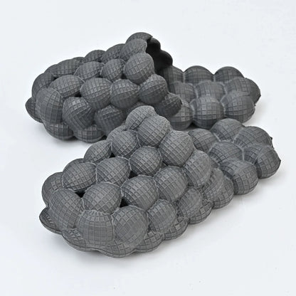 Comfortable massage bubble slides with breathable mesh upper and non-slip soles for indoor relaxation and pampering
