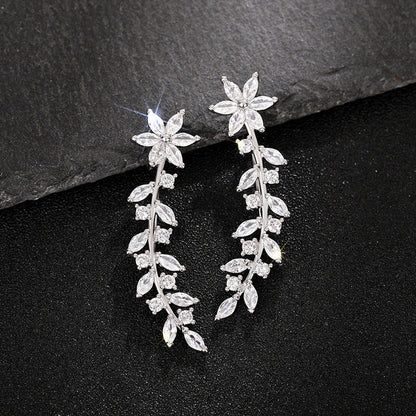 Stylish diamond flower earrings for women in white gold, gold, and rose gold