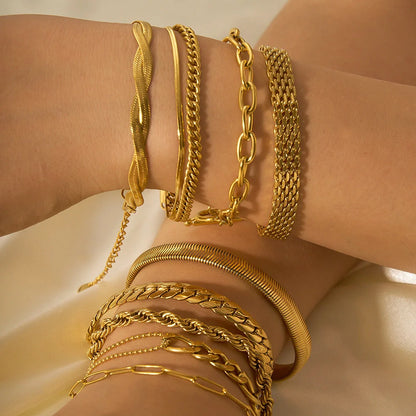 Stainless steel bracelet with real gold treatment in various colours, featuring geometry shapes and ring elements