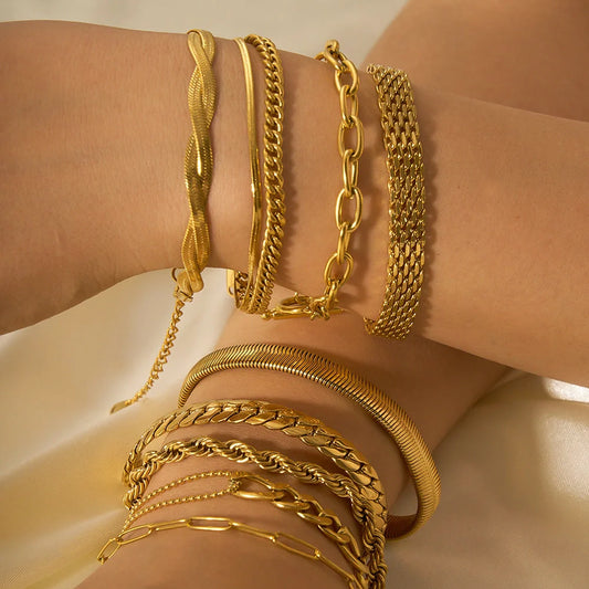 Stainless steel bracelet with real gold treatment in various colours, featuring geometry shapes and ring elements