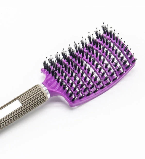 A premium hair brush with a sleek design, featuring soft bristles and a rounded massage function for healthy, detangled hair