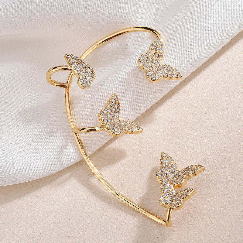 Sparkling butterfly-shaped ear cuffs with zirconia stones, available in gold and silver alloy finishes