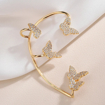 Sparkling butterfly-shaped ear cuffs with zirconia stones, available in gold and silver alloy finishes