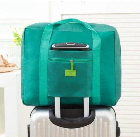 Foldable nylon travel holdall in various colours, including black, orange, green, and red