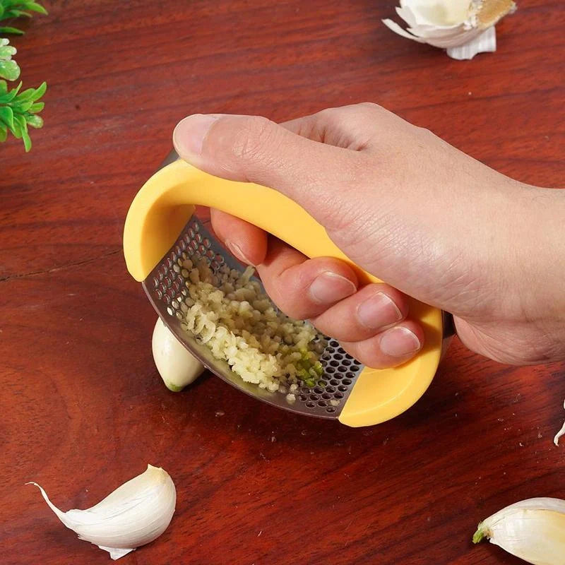 Stainless steel garlic press with ergonomic handle for easy mashing