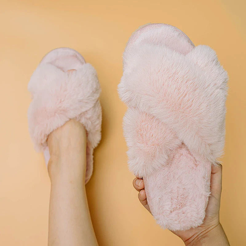 Cosy faux fur slippers in a variety of classic British colours, featuring a stylish cross-over design for indoor comfort and sophistication.