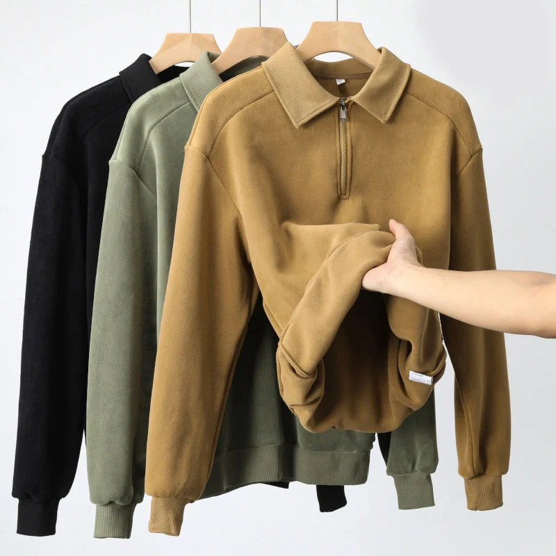 Premium fleece half-zip hoodie in black, haze green, and apricot yellow colours, featuring a tailored design and ribbed details for a refined look.