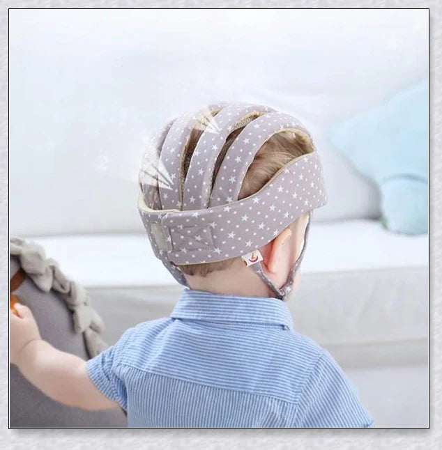 Heavy-duty baby flat head protector helmet in various colours, featuring breathable cotton material, adjustable straps, and shock-absorbing cushions for ultimate safety and comfort.