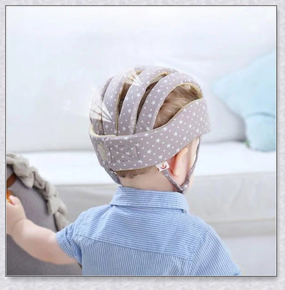 Heavy-duty baby flat head protector helmet in various colours, featuring breathable cotton material, adjustable straps, and shock-absorbing cushions for ultimate safety and comfort.