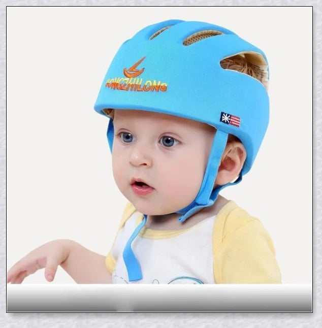 Heavy-duty baby flat head protector helmet in various colours, featuring breathable cotton material, adjustable straps, and shock-absorbing cushions for ultimate safety and comfort.