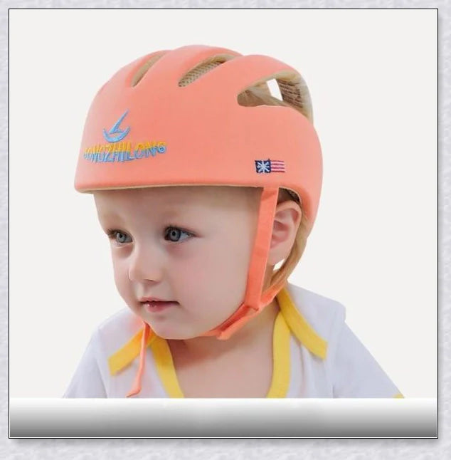 Heavy-duty baby flat head protector helmet in various colours, featuring breathable cotton material, adjustable straps, and shock-absorbing cushions for ultimate safety and comfort.