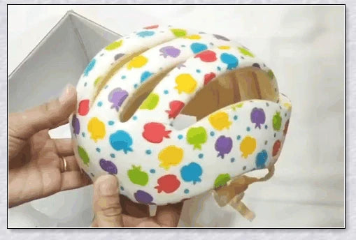 Heavy-duty baby flat head protector helmet in various colours, featuring breathable cotton material, adjustable straps, and shock-absorbing cushions for ultimate safety and comfort.