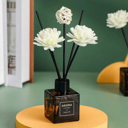 A luxurious jasmine reed diffuser set with a decorative plastic flower, designed to infuse your home with a captivating and calming fragrance.