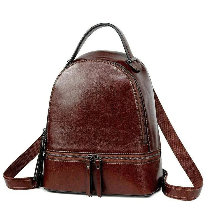 A stylish leather backpack in a variety of colours, featuring a classic oil-waxed cowhide design and practical storage compartments.