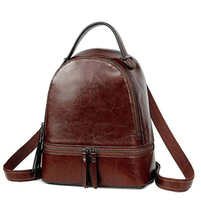 A stylish leather backpack in a variety of colours, featuring a classic oil-waxed cowhide design and practical storage compartments.