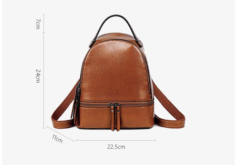 A stylish leather backpack in a variety of colours, featuring a classic oil-waxed cowhide design and practical storage compartments.