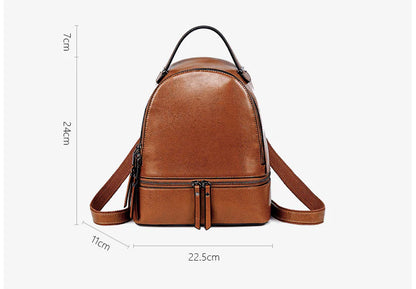 A stylish leather backpack in a variety of colours, featuring a classic oil-waxed cowhide design and practical storage compartments.