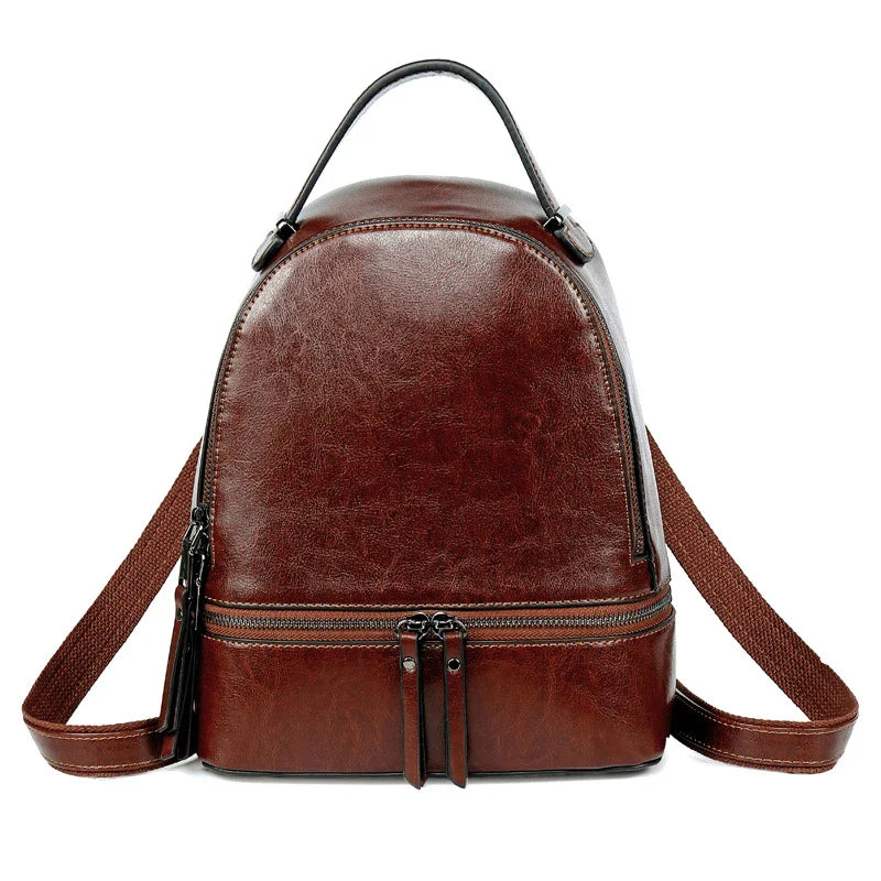 A stylish leather backpack in a variety of colours, featuring a classic oil-waxed cowhide design and practical storage compartments.