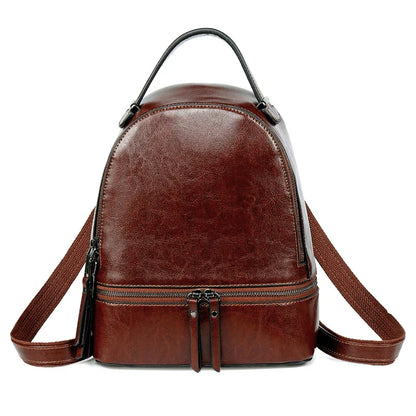 A stylish leather backpack in a variety of colours, featuring a classic oil-waxed cowhide design and practical storage compartments.