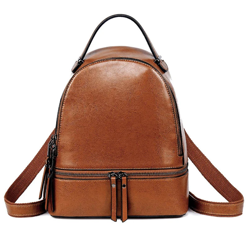 A stylish leather backpack in a variety of colours, featuring a classic oil-waxed cowhide design and practical storage compartments.