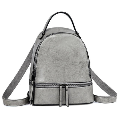 A stylish leather backpack in a variety of colours, featuring a classic oil-waxed cowhide design and practical storage compartments.