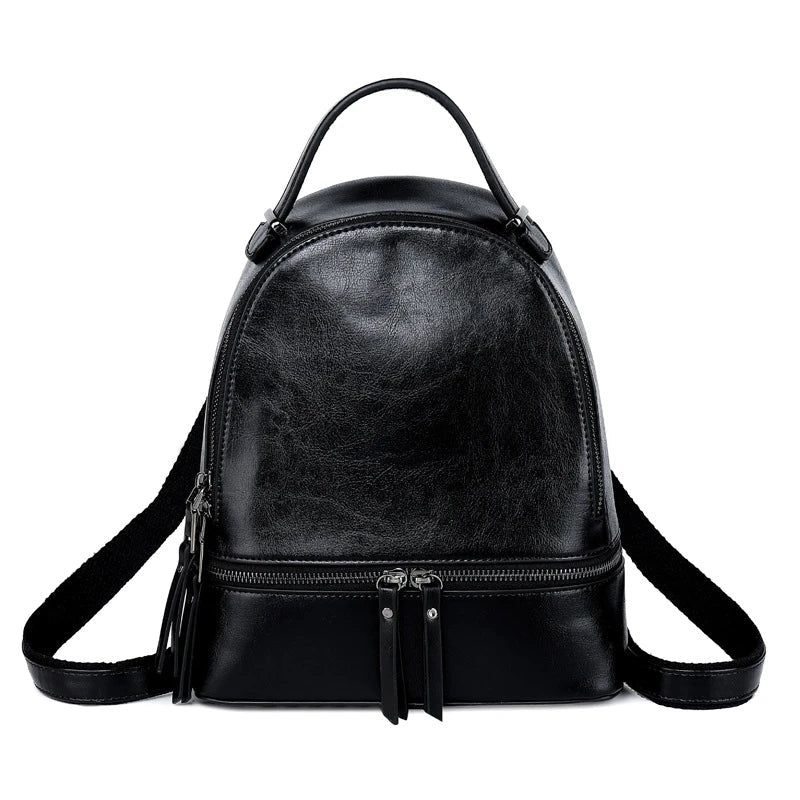 A stylish leather backpack in a variety of colours, featuring a classic oil-waxed cowhide design and practical storage compartments.