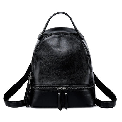 A stylish leather backpack in a variety of colours, featuring a classic oil-waxed cowhide design and practical storage compartments.