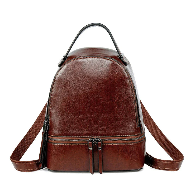 A stylish leather backpack in a variety of colours, featuring a classic oil-waxed cowhide design and practical storage compartments.