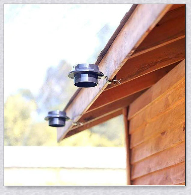 Premium solar-powered gutter lights illuminating an outdoor patio area at night