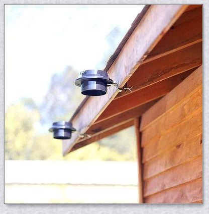 Premium solar-powered gutter lights illuminating an outdoor patio area at night