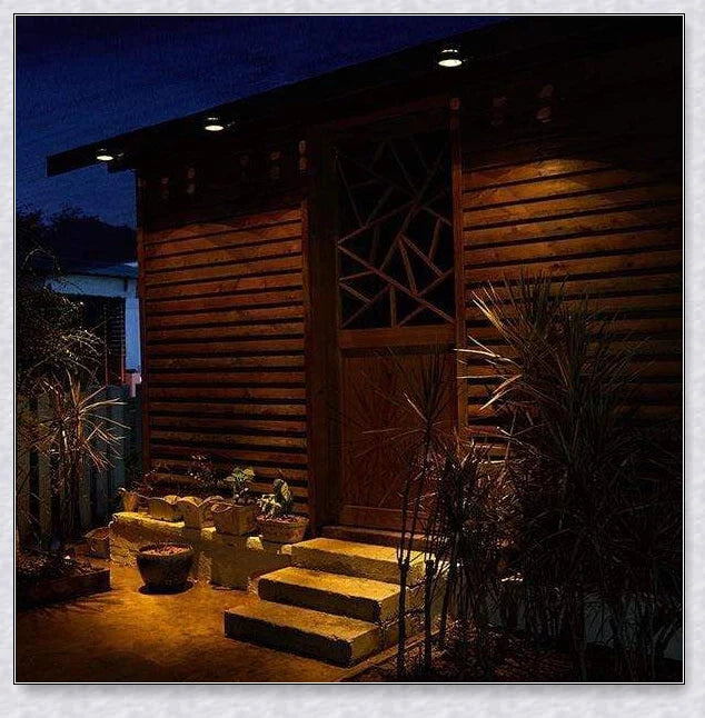 Premium solar-powered gutter lights illuminating an outdoor patio area at night