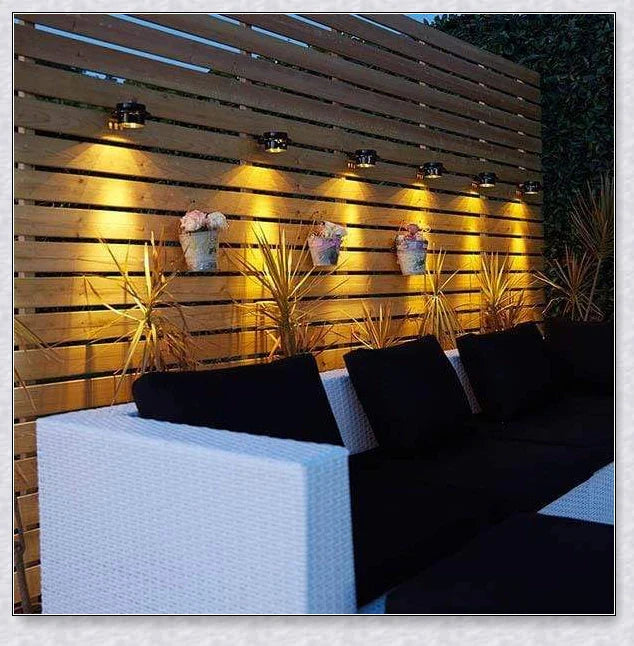 Premium solar-powered gutter lights illuminating an outdoor patio area at night