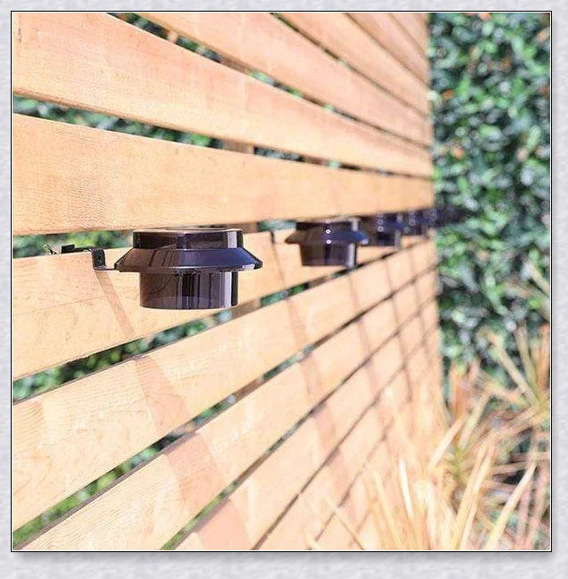 Premium solar-powered gutter lights illuminating an outdoor patio area at night
