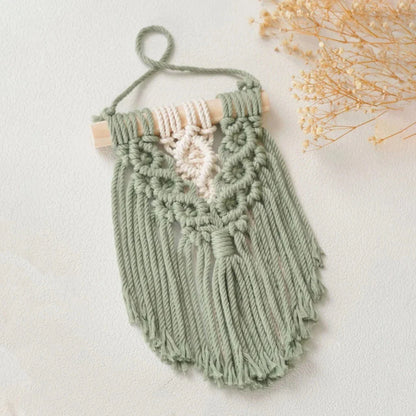 Handmade macrame wall hanging tapestry in creamy-white colour, featuring intricate patterns and natural textures