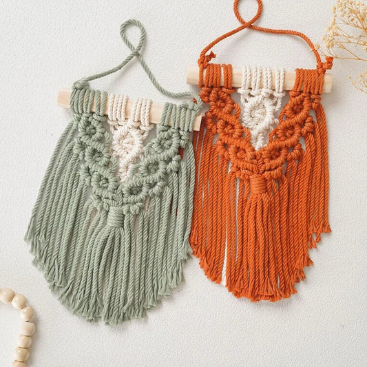 Handmade macrame wall hanging tapestry in creamy-white colour, featuring intricate patterns and natural textures