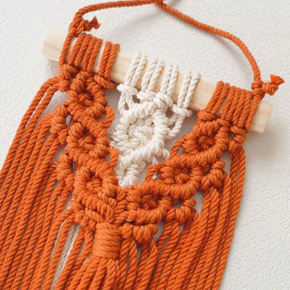 Handmade macrame wall hanging tapestry in creamy-white colour, featuring intricate patterns and natural textures