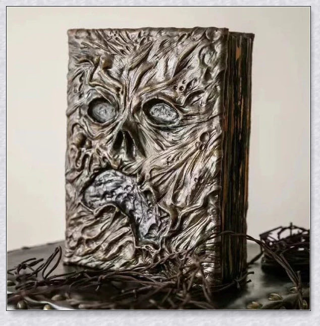 Aged Necronomicon prop with demonic face cover, perfect for dark fantasy decor