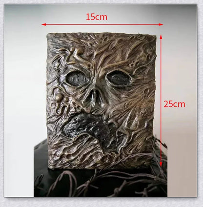 Aged Necronomicon prop with demonic face cover, perfect for dark fantasy decor