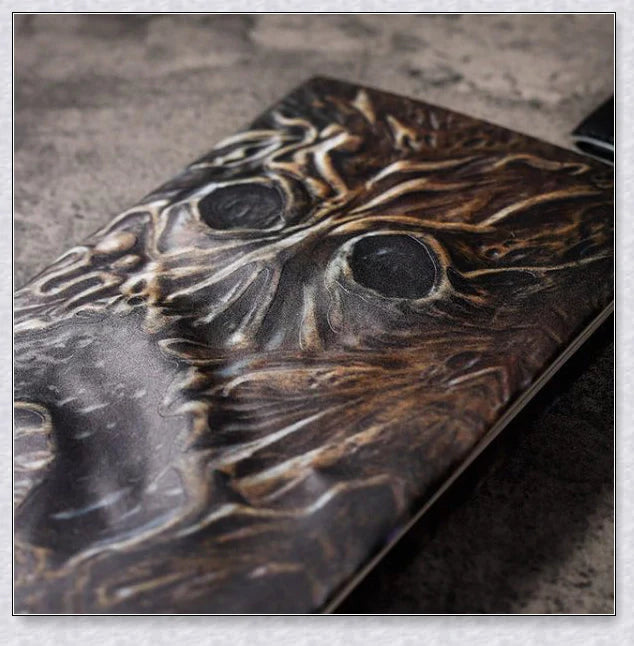 Aged Necronomicon prop with demonic face cover, perfect for dark fantasy decor
