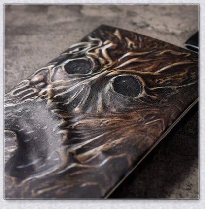 Aged Necronomicon prop with demonic face cover, perfect for dark fantasy decor
