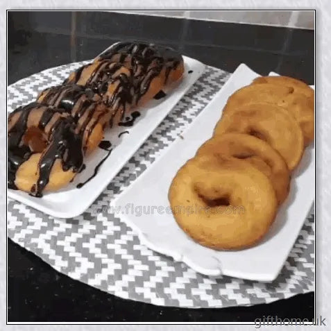 A white and stainless steel donut maker that can create full-size or mini donuts with ease