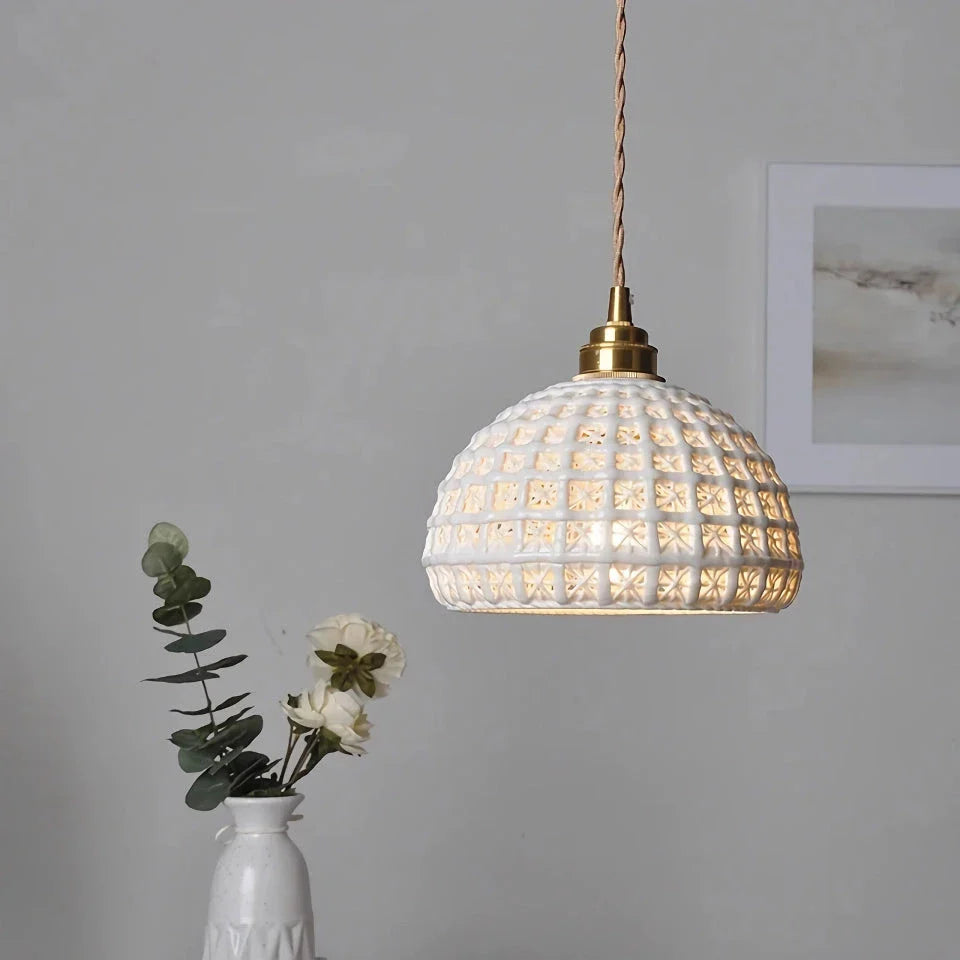 Modern LED ceramic pendant lights in a white finish, creating a warm and inviting ambiance in a living room.