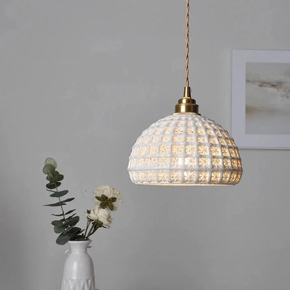 Modern LED ceramic pendant lights in a white finish, creating a warm and inviting ambiance in a living room.