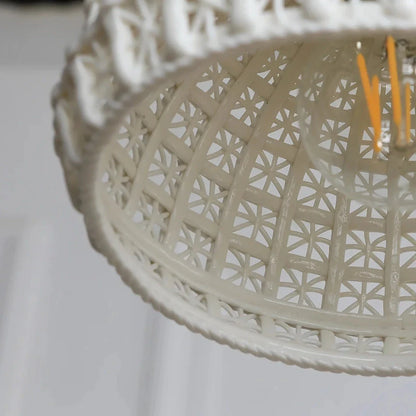 Modern LED ceramic pendant lights in a white finish, creating a warm and inviting ambiance in a living room.