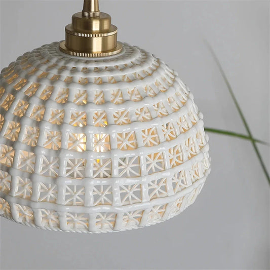 Modern LED ceramic pendant lights in a white finish, creating a warm and inviting ambiance in a living room.