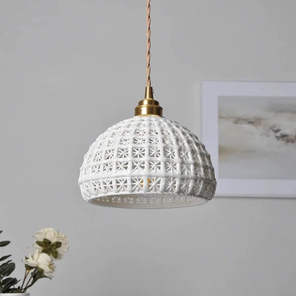 Modern LED ceramic pendant lights in a white finish, creating a warm and inviting ambiance in a living room.