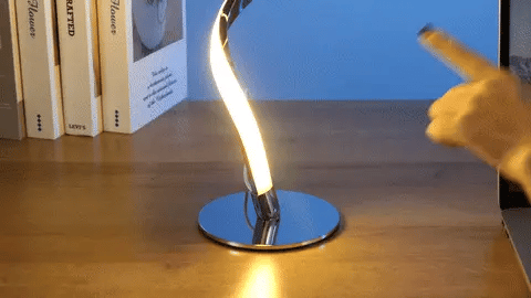 Stylish modern spiral table lamp with adjustable brightness and three colour modes