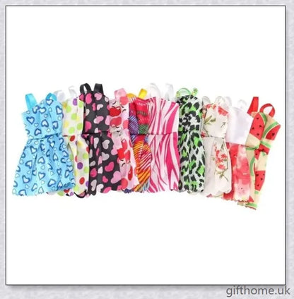 An assortment of 85 Barbie doll accessories including dresses, shoes, jewellery, and other fashion items