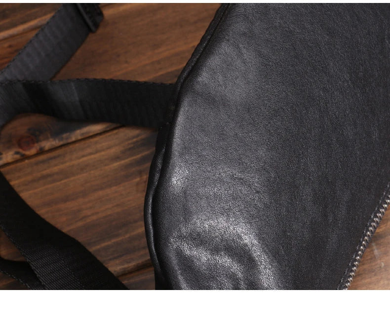 A premium black leather sports waist pack with multiple pockets and an adjustable strap for hands-free mobility and convenience.