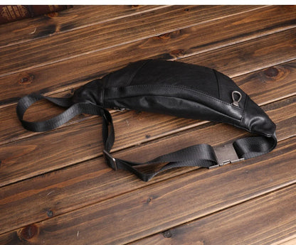 A premium black leather sports waist pack with multiple pockets and an adjustable strap for hands-free mobility and convenience.